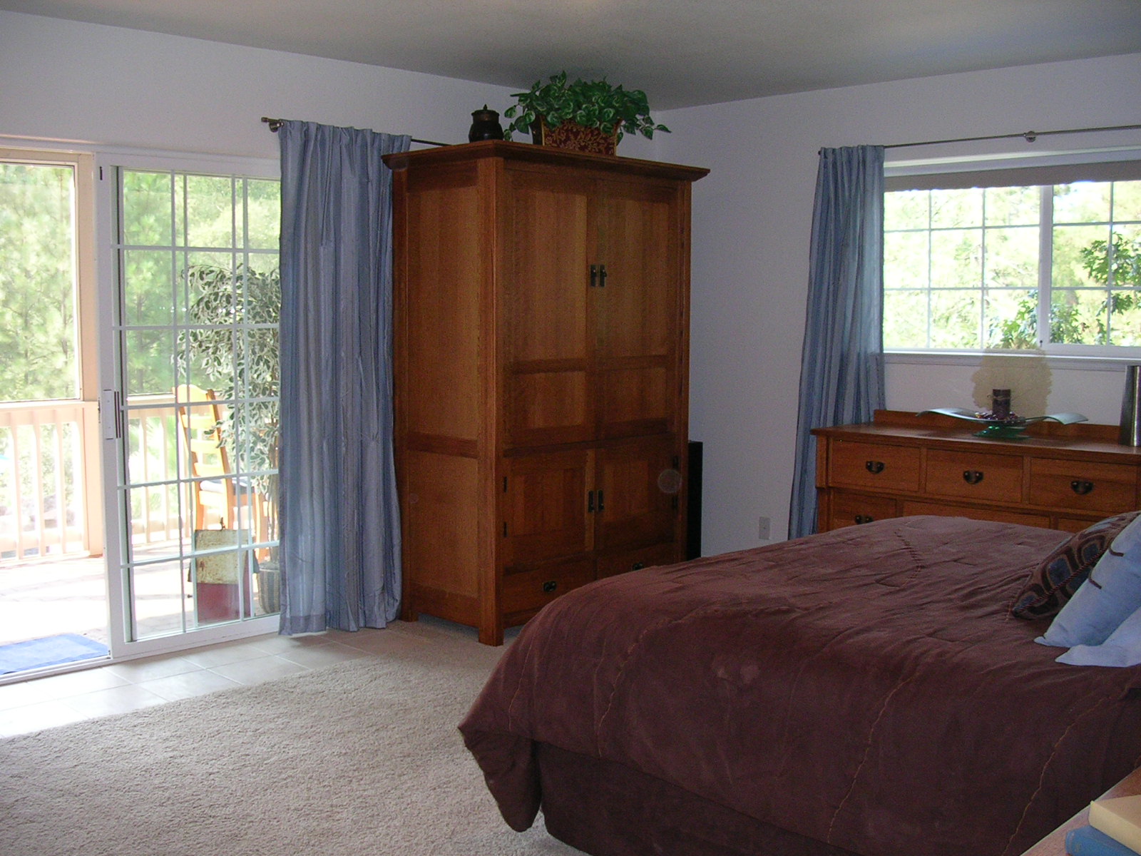 Master suite looking out to screened porch and pool.