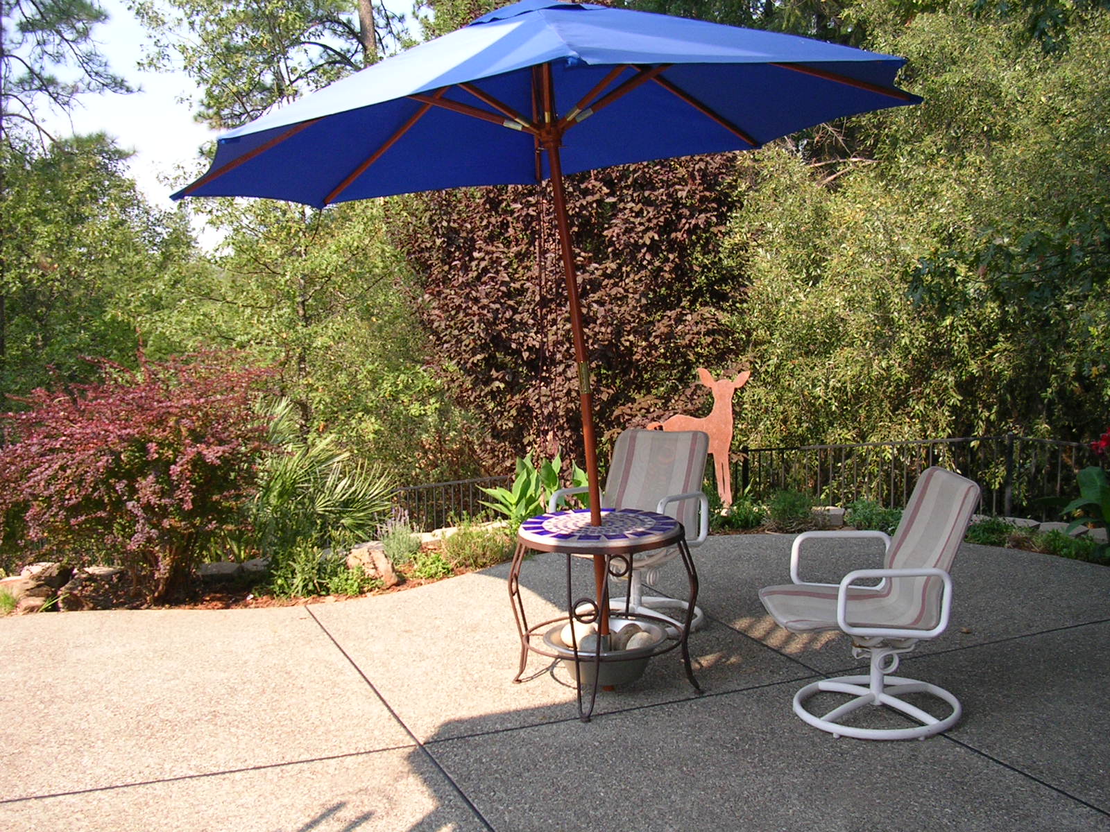 Lower patio area with BBQ station.